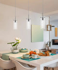 Bubble Glass Crystal Pendant Lights 3-Pack For Kitchen Island over dining table setting with brushed nickel finish.