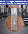 Workhorse Filament Tape 2 Inch By 30 Yards Reinforced Packing Tape lifting weight, demonstrating strong adhesive bond