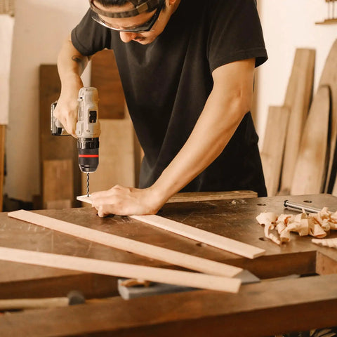 Person using Keyless Drill Chuck Set For Hand Drills And Impact Drivers, Adds One Half Inch 20 UNF Mount in woodworking shop.