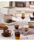 Kickstart Your Daily Hype With This Top Shelf Italian Espresso Coffee Maker featuring drinks on a counter with a modern design.