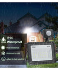 JUDYSSY Led Flood Light Pir Motion Sensor 30W in rain, showcasing IP66 waterproof design and motion sensor features.