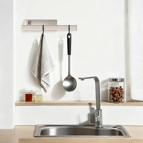 No Drill Self Adhesive Towel Holder 9 Inch Stainless Steel Bar In Brushed Gold Finish over a kitchen sink with a towel