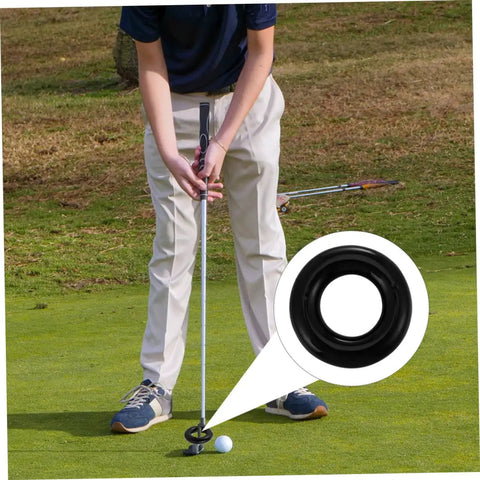 Golfer using Two Pack Golf Weighted Swing Training Ring for stability and muscle memory during practice, black donut weight