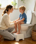 Mother with child on a Hassle Free Quick Swap Elongated Toilet Seat With Built In Toddler Potty Chair And Silent Soft Close Hinges.