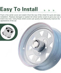 Heavy Duty Push Through Trailer Wheel Center Caps Boasting A Slick Chrome Polish For A Tight Universal Mount On Truck Rv And Suv Rims Using Durable Carbon Steel on a white wheel.