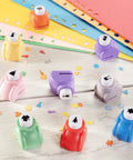 Mini Scrapbook Paper Hole Puncher Set With Forty Holiday Designs featuring colorful punchers and paper confetti on a table