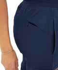 Side view of Women's Slim Fit Jogger Scrub Pants With Elastic Yoga Waistband showcasing deep side pocket for phones.