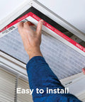 Person installing PureAir MERV 8 Allergen Pleated Electrostatic Air Filter For 20x25x1 HVAC AC Furnaces Keeps Pollen, Dust And Junk Out