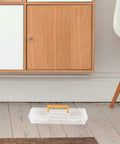 Straight Up Plastic Tool Box With Sturdy Carry Handle Divided Multi Purpose Compartments For Weekend DIY Projects Hardware Sorting Paint Brush Holder And Small Gear on wooden floor near furniture.
