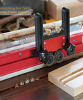 2Pcs Table Saw Feather Board With Dual Bearing Rollers And Adjustable Safety Push Block For Dead Nuts Secure Guide And Smooth As Silk Feed Tracking On Table Saws Or Router Tables, close-up of red and black guide.