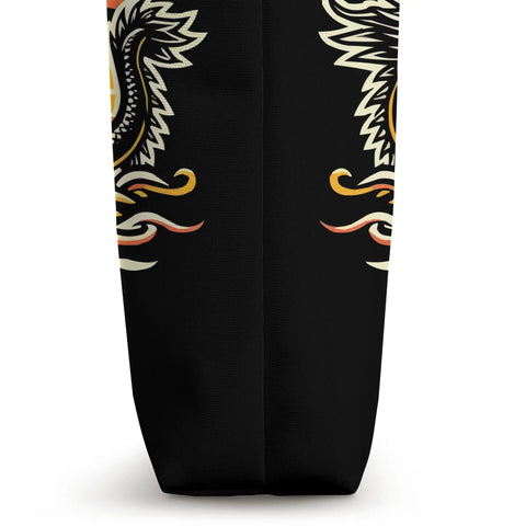 Close-up of Dragon Boat Racing Paddler Tote Bag showing black polyester fabric with dragon design, side view.