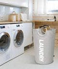 115L XXL Collapsible Laundry Hamper With Aluminum Soft Grip Handle in laundry room setting