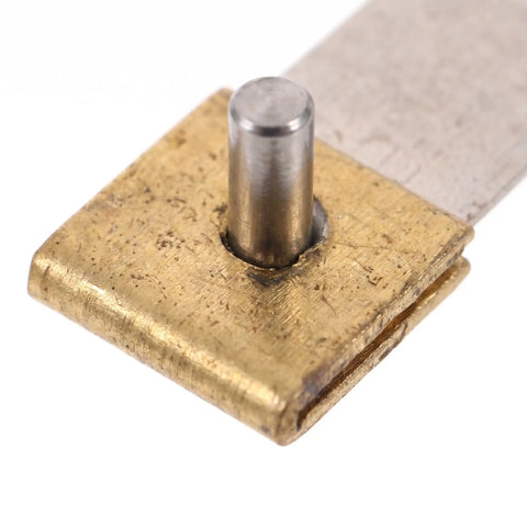 Close-up of Old School Pendulum Suspension Spring Replacement Kit for Vintage Grandfather Clocks in brass and steel.