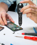 Person using Coil Tester For Motherboards With Compact Housing Fast Inductor Fault Check Device on phone circuit board