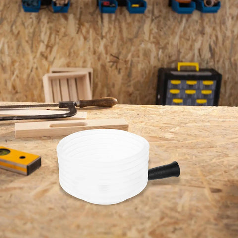 Heavy Duty Hole Saw Dust Bowl Catcher on workbench, durable material designed to clamp tightly to bits and trap dust.