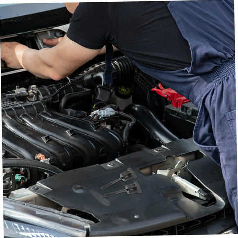 Mechanic working on engine with Spare Tire Hold Down Hardware With Durable Aluminum Alloy Mounting Bolt Clamp visible