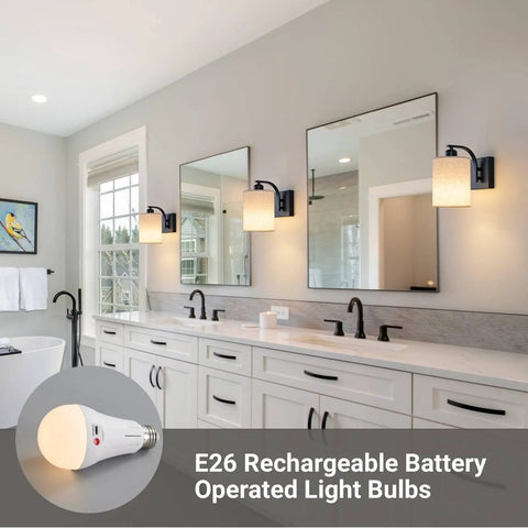 Sleek Matte Black Rechargeable Wall Sconces Set Of Two Wireless Dimmable Led Lights With Remote Easy Setup For Bedroom And Living Room All Day Battery Operated Lamps Heavy Duty Build Badass Style in a stylish bathroom setting.