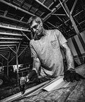 Person using Air Nibbler With Angled Head 4200 SPM Front Exhaust Cuts Up To 18 Gauge Steel Aluminum Or Plastic in workshop.