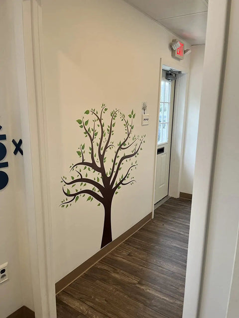 Giant Cartoon Brown Tree Wall Decals Set on hallway wall, Peel and Stick Leaves, Removable Wall Sticker for instant cozy vibe