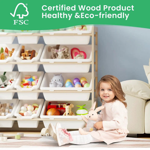 Child sitting beside Kiddo Friendly Toy Storage Organizer With Bookshelf, Three Shelves And Twelve Bins, White Pine Wood Toy Cabinet