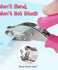 Sweet Two Size Hole Punch Set With Soft Grip Handle punching a paper; close-up of 1/4 inch hole; pink handle grip; for crafts and scrapbooks