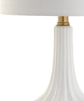 Detail of Dope White Ceramic Gold Ribbed Gourd Table Lamp 21.5 Inches With White Linen Shade showing ribbed ceramic and gold accents