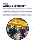 Staff at Wheel & Sprocket bike shop standing with bicycles in front of a banner