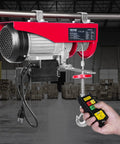 Front view: red VEVOR electric hoist with wireless remote, 110V, 440lb capacity, hook.