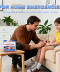 TLIEAO mini first aid kit, pink case with blue latches, 150 pieces, shown on table as man applies a bandage to a girl.