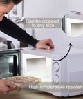 Man using 10 Piece Microwave Waveguide Cover Set With 5.9 By 4.7 Inches Mica Sheets as easy-cut replacement for heat insulation.