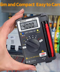 Person holding Starter-Friendly Digital Multimeter Card Tester with Auto Ranging 4000 Count next to electrical panel