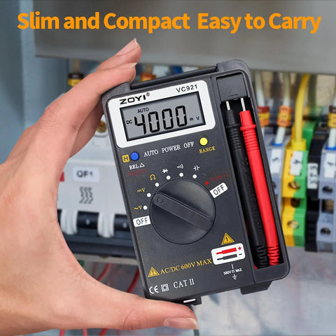 Person holding Starter-Friendly Digital Multimeter Card Tester with Auto Ranging 4000 Count next to electrical panel