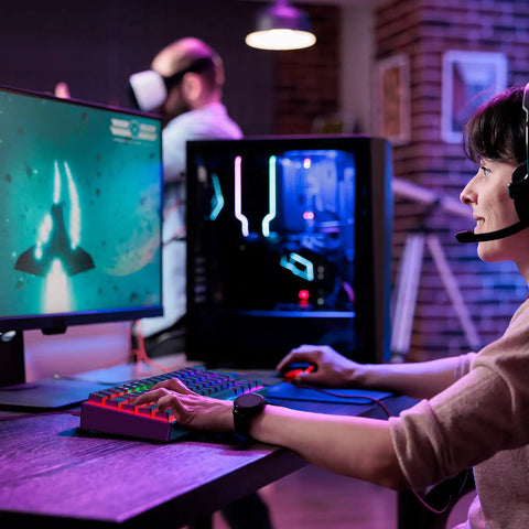 Person gaming with Compact 60 Percent Mechanical Gaming Keyboard Featuring Silky Linear Red Switches And Detachable Type C Cable.