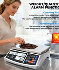 Person using Heavy Duty Industrial Counting Scale 30kg 66lb With 0.1g Precision Bench Scale For Inventory Counting Of Small Parts And Coins