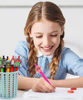 Girl using 60 Piece Funny Pens Set For Adults With Positive Quotes And Quirky Graphics Like Cute Animals, Rainbows, Aliens, And Retro Designs.