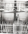 Interior view of a dishwasher showing prongs and a grey utensil basket, highlighting 50 Piece Flexible Dishwasher Rack End Covers Tough Vinyl Caps For Prong Guard Dead Simple Swap Out Stops Rust And Wear Keeps Your Kitchen Running Smooth As New.