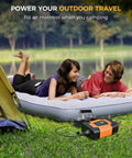Couple using On The Go 750W Car Power Inverter with 2 AC Outlets to power an air mattress outdoors