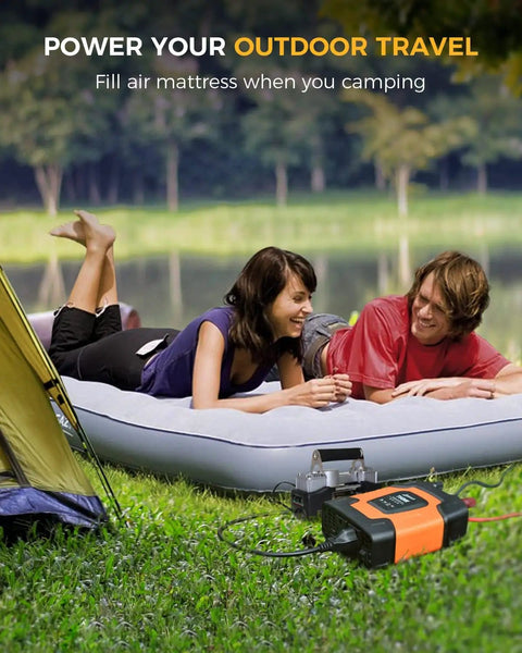 Couple using On The Go 750W Car Power Inverter with 2 AC Outlets to power an air mattress outdoors