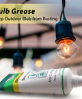 Image showing tube of dielectric grease for electrical connectors near outdoor bulb