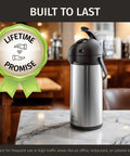Insulated Stainless Steel Airpot Carafe With Pump 102oz 3L for Parties on a marble table in a café setting