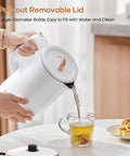 Fast Boil Electric Kettle 1500W 1.8L Stainless Steel Auto Shut Off Boil Dry Protection pouring water into a glass