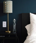 20 Amp Tamper Resistant Outlet 125V Decorator Duplex Receptacle on bedroom wall above nightstand