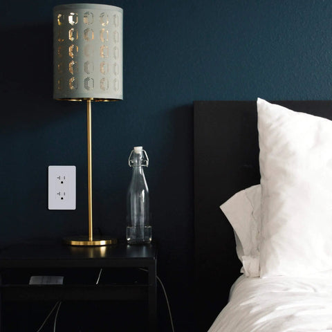 20 Amp Tamper Resistant Outlet 125V Decorator Duplex Receptacle on bedroom wall above nightstand
