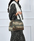 Desert Cactus Insulated Lunch Bag For Women And Men With Fashion Print held by person, showcasing desert scene print and black handle.