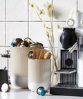 Two Piece Ceramic Utensil Holder Set For Kitchen Counter With Fluted Warm White Glaze Large 7.3 Inch And Small 5.4 Inch Crocks For Spatulas Spoons Whisks And More Perfect Countertop Organizer next to coffee machine