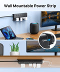 Power Strip Surge Protector With 10 Widely Spaced Outlets 2 USB C Ports And 2 USB A Ports 1875W 4000J Surge Protection, mounted on a desk.