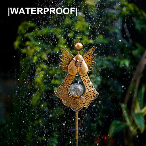Angel Stake Solar Lights With Crackle Glass Globe Waterproof Warm White LEDs, shown in rain, 40.5 Inch metal bronze garden stake.