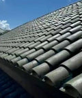 Heavy Duty Tile Roof Glaze And Clear Shielding Sealant With Urethane Reinforced Strength For Tough As Nails Weather Barrier And A Sleek Satin Finish That Gonna Save Your Tiles From Failing In A Practical Five Gallon Size on a sunlit clay tile roof.