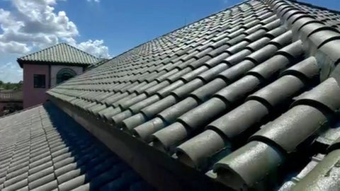 Heavy Duty Tile Roof Glaze And Clear Shielding Sealant With Urethane Reinforced Strength For Tough As Nails Weather Barrier And A Sleek Satin Finish That Gonna Save Your Tiles From Failing In A Practical Five Gallon Size on a sunlit clay tile roof.