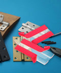 Clear Acrylic Self Adhesive Hinge Set Four Pack Adjustable Folding Hinges with red tape near metal hinges